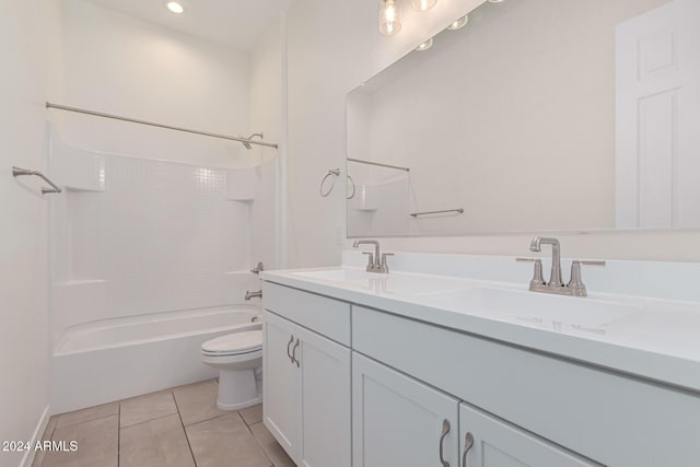 full bathroom featuring tile patterned flooring, vanity, toilet, and washtub / shower combination