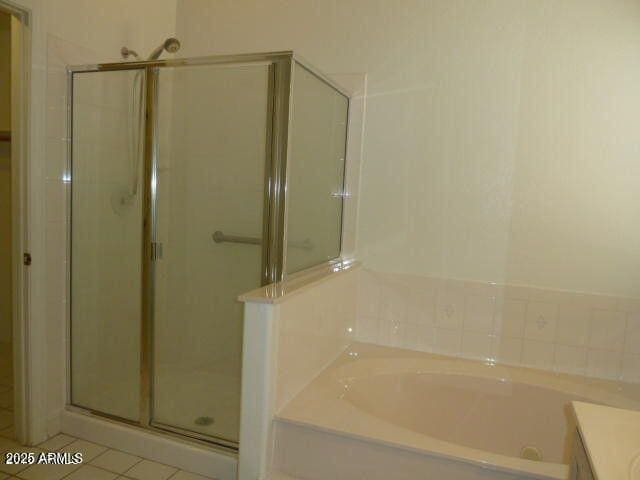 full bath with tile patterned flooring, a shower stall, a bath, and vanity