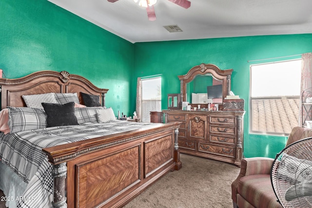 bedroom featuring visible vents, carpet, and ceiling fan