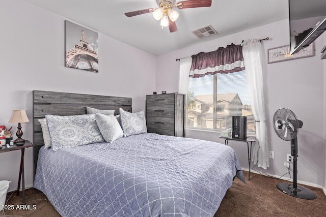 carpeted bedroom with visible vents, ceiling fan, and baseboards