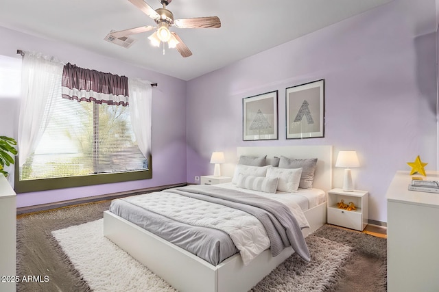 bedroom featuring a ceiling fan and visible vents