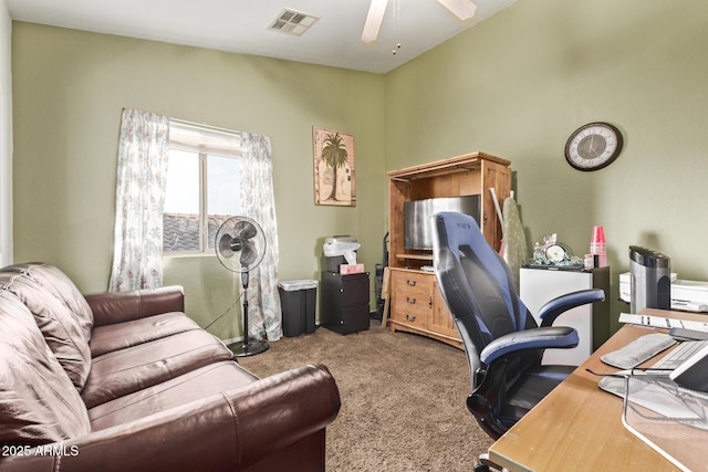 office area with visible vents, ceiling fan, and carpet flooring