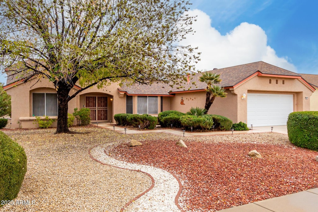 single story home with a garage