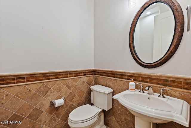 30406 N 54th St, Cave Creek, AZ 85331 - half bath with toilet, a wainscoted wall, a sink, and tile walls