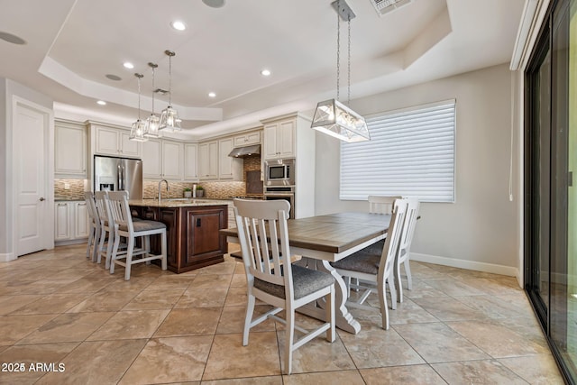30406 N 54th St, Cave Creek, AZ 85331 - dining room featuring a raised ceiling, baseboards, a chandelier, and recessed lighting