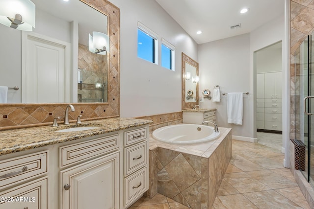 30406 N 54th St, Cave Creek, AZ 85331 - full bathroom featuring a shower stall, vanity, a garden tub, recessed lighting, and tasteful backsplash