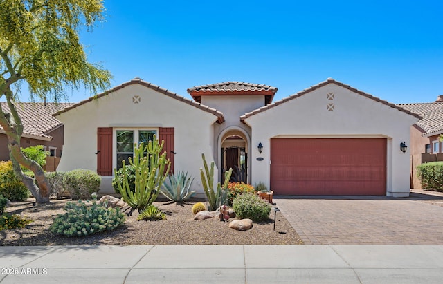 30406 N 54th St, Cave Creek, AZ 85331 - mediterranean / spanish-style home with an attached garage, stucco siding, a tiled roof, and driveway