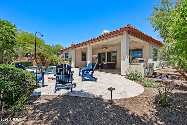 30406 N 54th St, Cave Creek, AZ 85331 - rear view of house featuring a ceiling fan, a patio, stucco siding, a tile roof, and a chimney