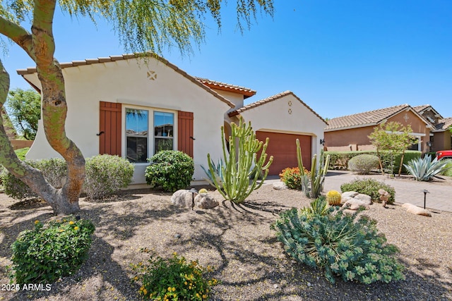 30406 N 54th St, Cave Creek, AZ 85331 - mediterranean / spanish-style house with an attached garage, a tiled roof, and stucco siding