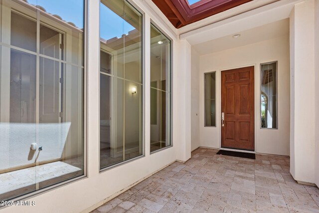 30406 N 54th St, Cave Creek, AZ 85331 - view of exterior entry featuring stucco siding and a patio area