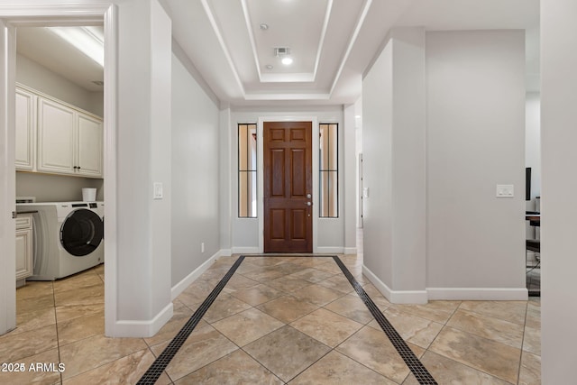 30406 N 54th St, Cave Creek, AZ 85331 - foyer entrance featuring washer / dryer, inlaid floor details, and baseboards