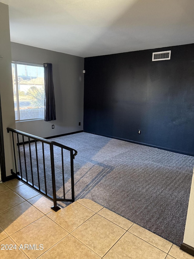 spare room featuring light tile patterned floors