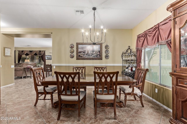 dining space with a chandelier