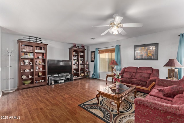 living room featuring hardwood / wood-style floors and ceiling fan