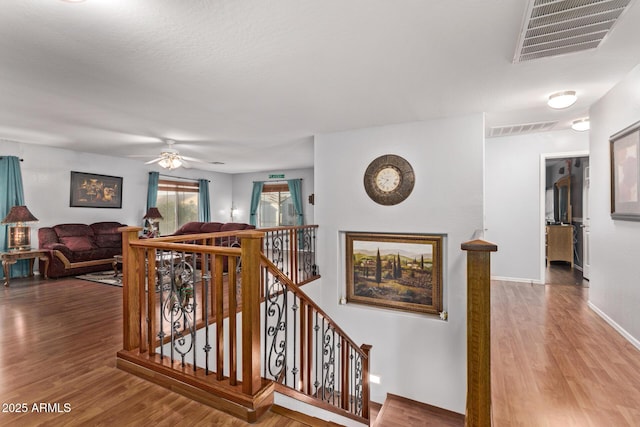 stairs with hardwood / wood-style flooring