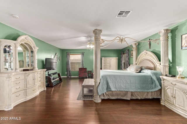 bedroom with dark hardwood / wood-style floors and ceiling fan