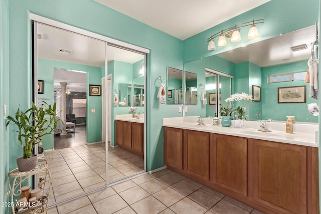 bathroom with tile patterned flooring and vanity