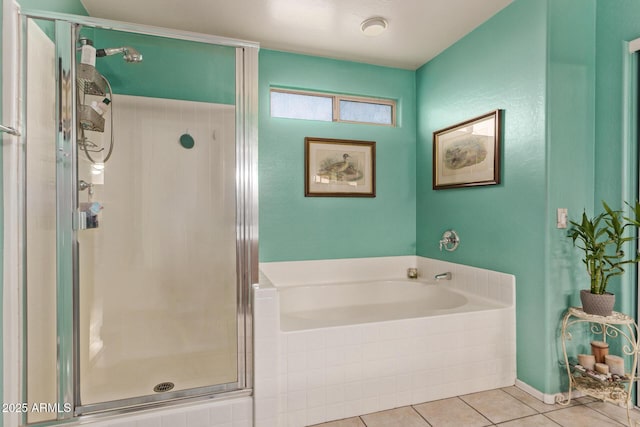 bathroom with tile patterned flooring and independent shower and bath