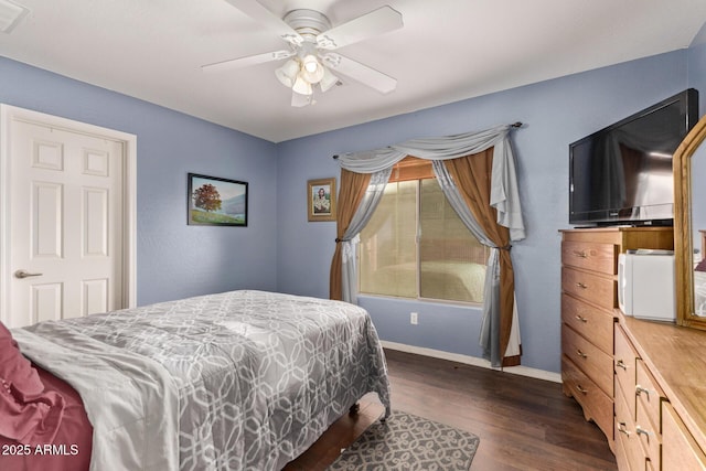 bedroom with ceiling fan and dark wood-type flooring