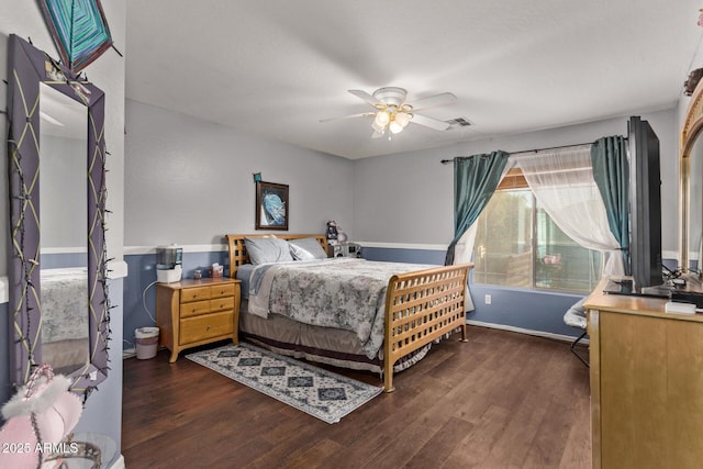 bedroom featuring ceiling fan and dark hardwood / wood-style floors