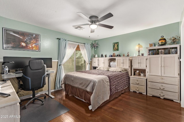 bedroom featuring dark hardwood / wood-style floors and ceiling fan