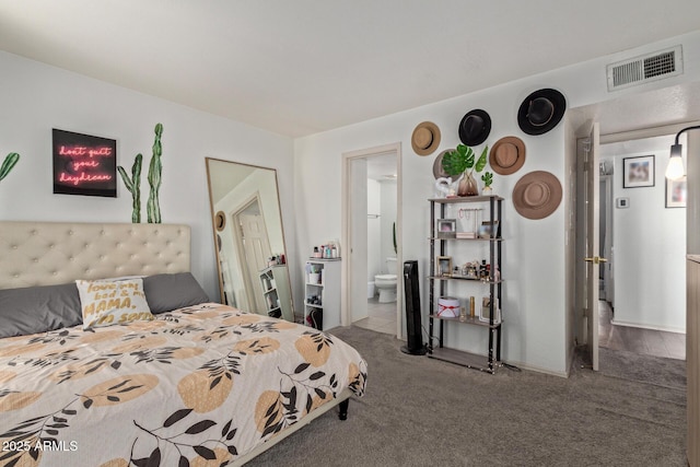 carpeted bedroom featuring ensuite bathroom