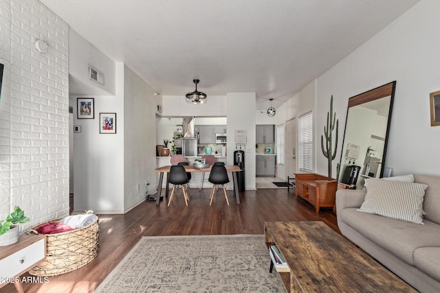 living room with dark hardwood / wood-style floors