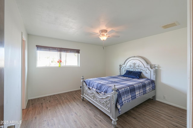 bedroom featuring ceiling fan and hardwood / wood-style floors