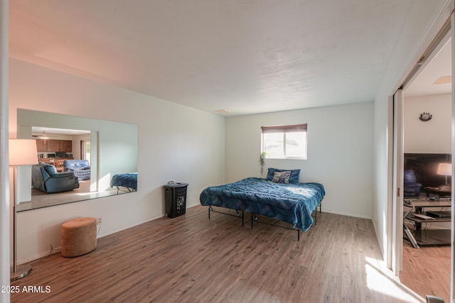 bedroom with wood-type flooring