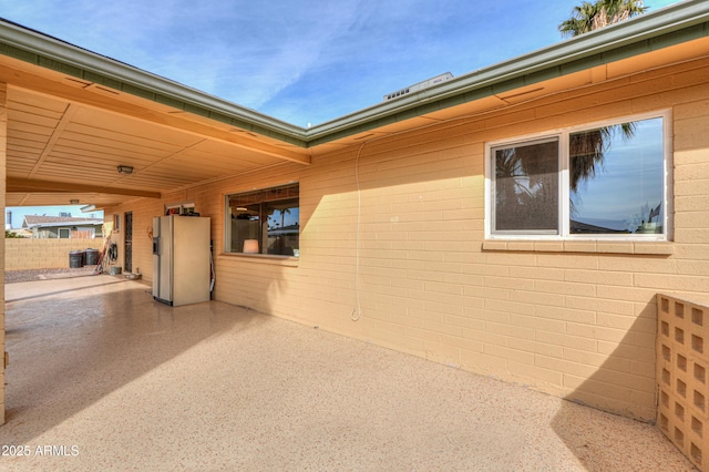 view of side of home featuring a patio area