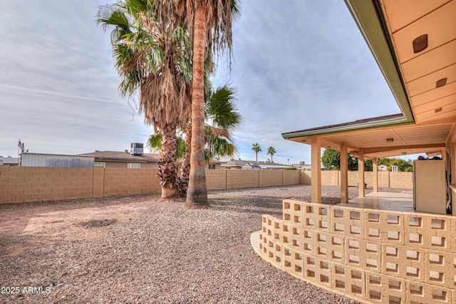 view of yard featuring a patio and central air condition unit