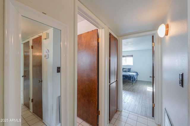 hallway featuring light tile patterned floors