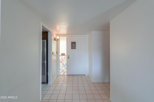 corridor featuring light tile patterned floors