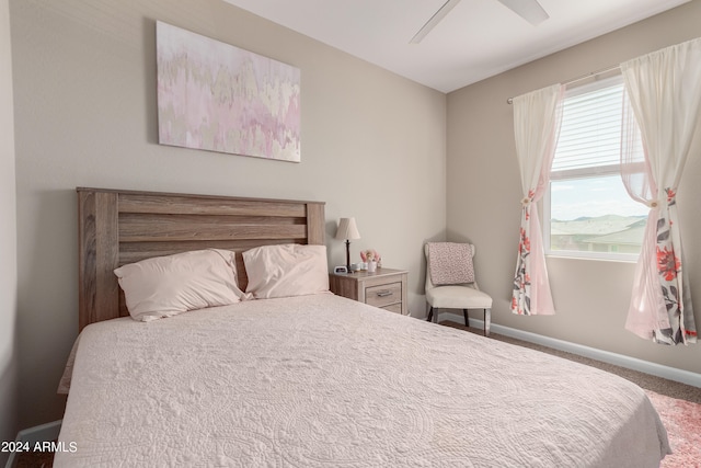 bedroom with ceiling fan and carpet floors