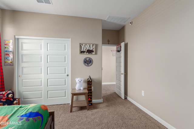 bedroom featuring a closet and carpet floors