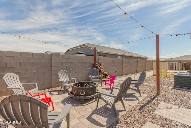 view of patio / terrace featuring cooling unit and an outdoor fire pit