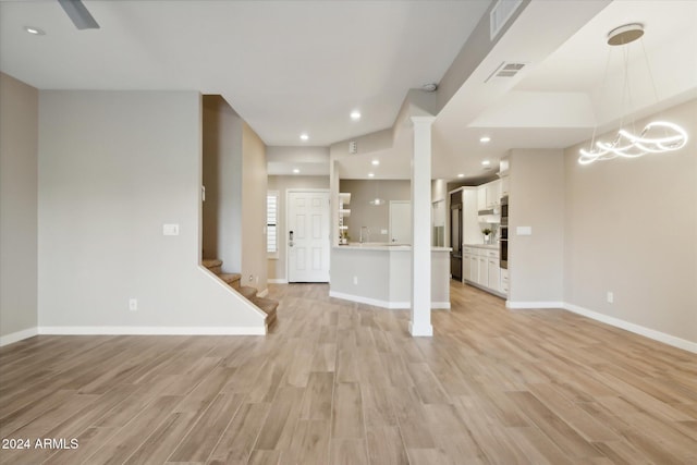 unfurnished living room featuring light hardwood / wood-style flooring