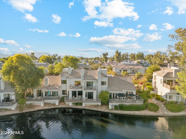 back of house featuring a water view