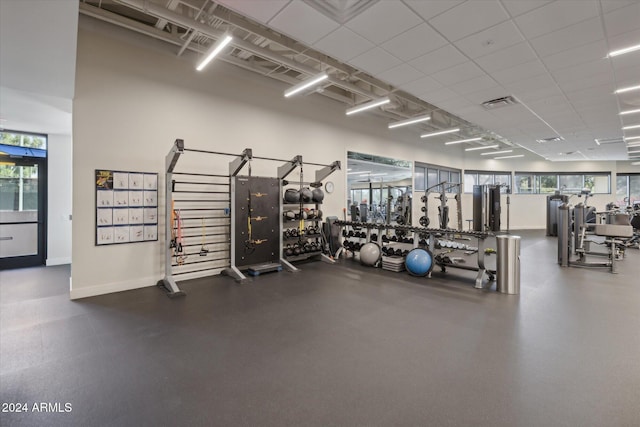 workout area with a drop ceiling