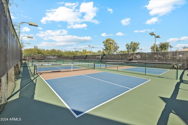 view of sport court with basketball hoop