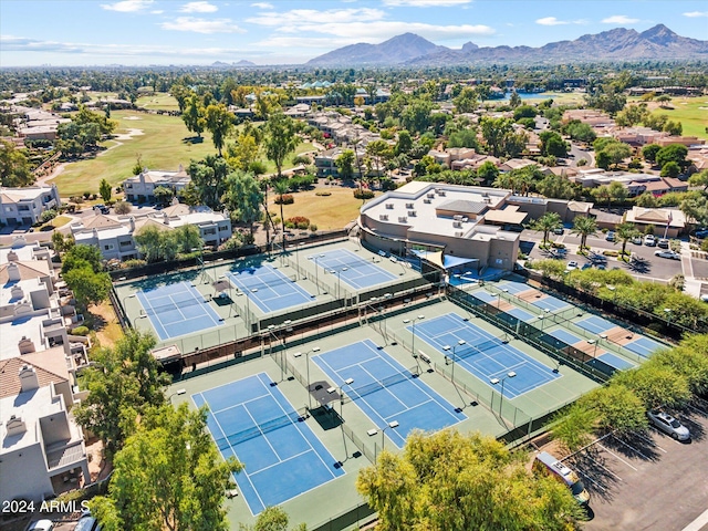 birds eye view of property with a mountain view