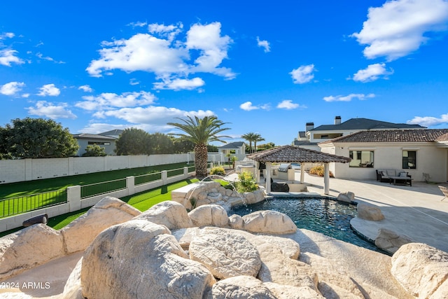 view of pool with a gazebo, a patio, and a lawn