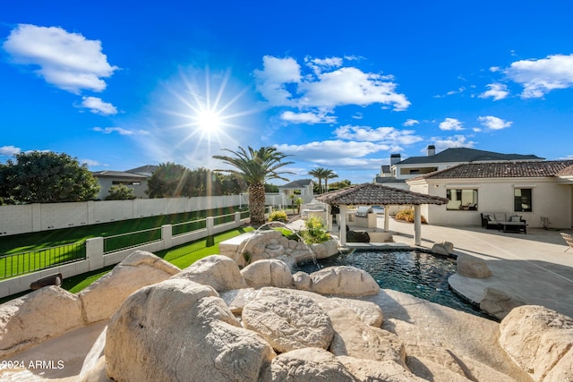 view of swimming pool featuring a gazebo, a patio area, and pool water feature