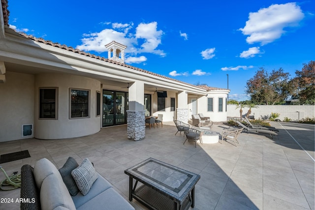 view of patio featuring an outdoor living space and ceiling fan