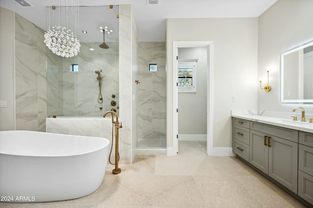 2335 E Plum St, Gilbert, AZ 85298 - full bathroom with a marble finish shower, vanity, a freestanding tub, and baseboards
