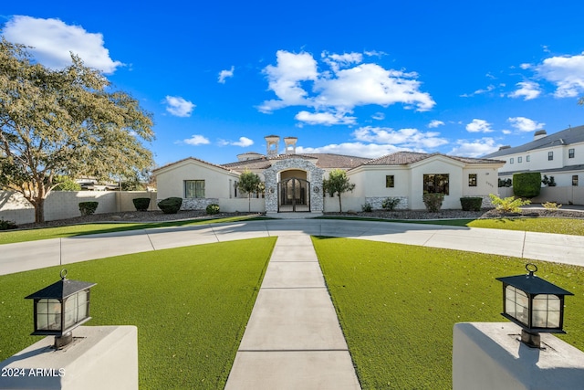 2335 E Plum St, Gilbert, AZ 85298 - mediterranean / spanish-style home featuring stone siding, french doors, and stucco siding