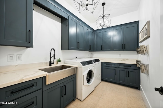 2335 E Plum St, Gilbert, AZ 85298 - laundry room with cabinet space, a chandelier, washing machine and dryer, and baseboards