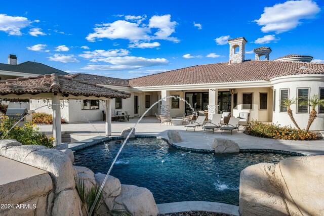 2335 E Plum St, Gilbert, AZ 85298 - back of house featuring a patio, a chimney, a tiled roof, and an outdoor pool