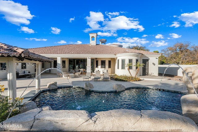 2335 E Plum St, Gilbert, AZ 85298 - back of house featuring a tile roof, a patio, stucco siding, and an outdoor pool
