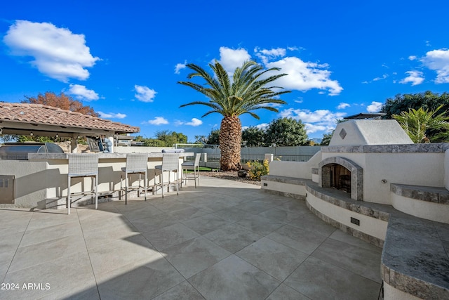 2335 E Plum St, Gilbert, AZ 85298 - view of patio featuring an outdoor bar and exterior fireplace